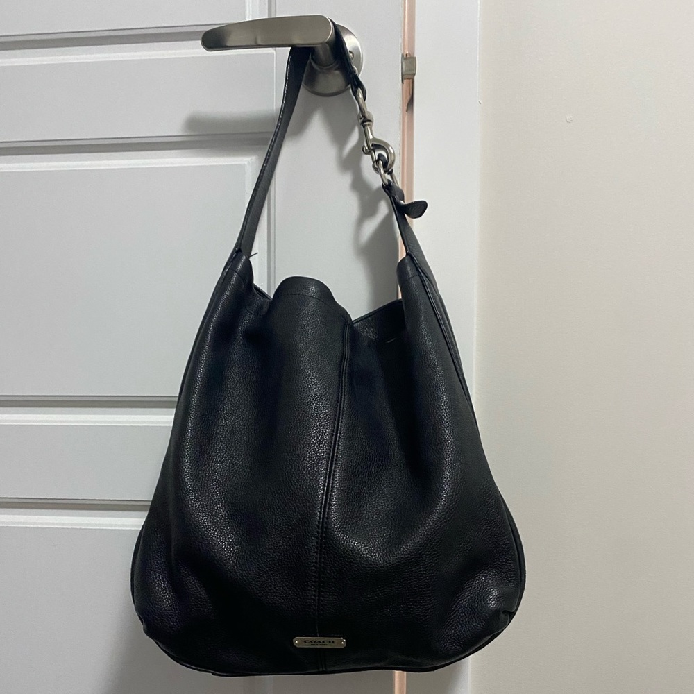 Black Coach Hobo Style bag with subtle stud detailing.
